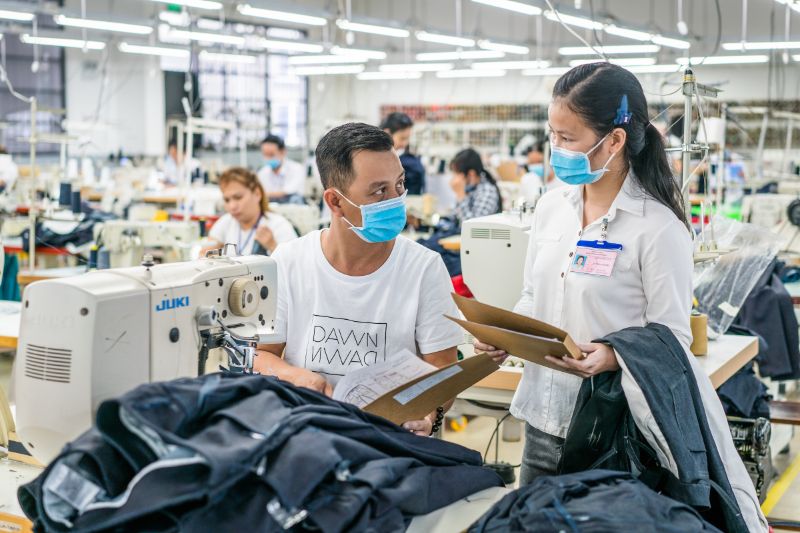 tip me factory workers at dawn denim in vietnam