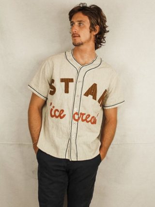 Tristan Detwiler, Founder of STAN, styling an upcycled STAN baseball shirt