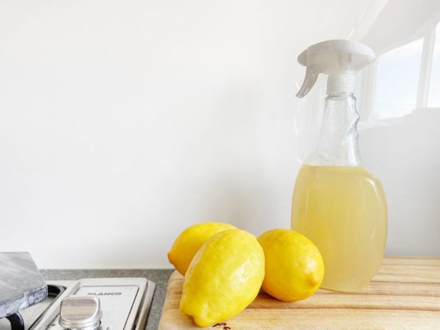 Natural spring green cleaning using fresh lemons and a spray bottle
