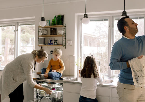 Family working in kitchen at home